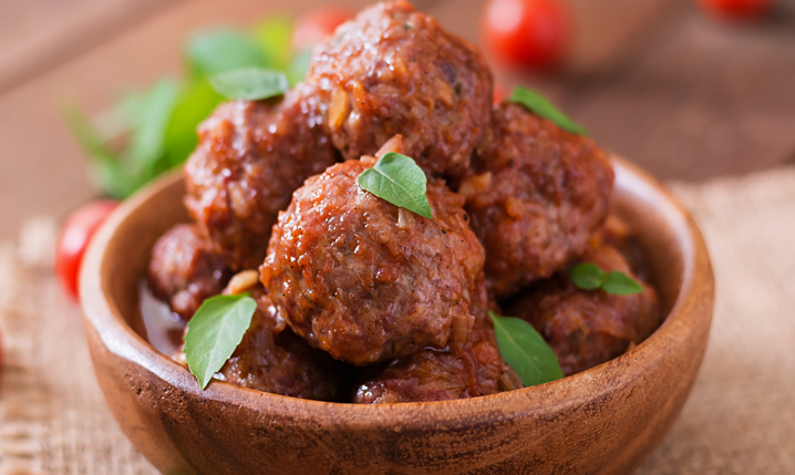 cooked meatballs in a wooden bowl