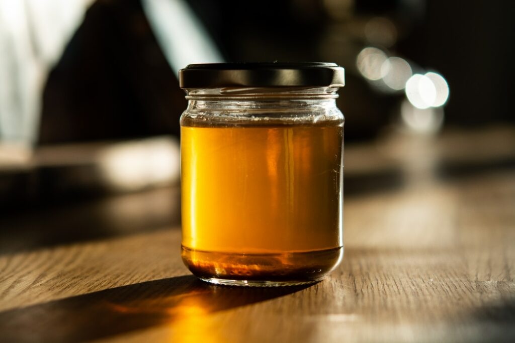 vegetable stock in a glass jar with lid closed over the top
